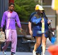 Rihanna covers her eyes with the bill of her yellow baseball cap during low-key shopping trip with baby daddy A$AP Rocky in Manhattan